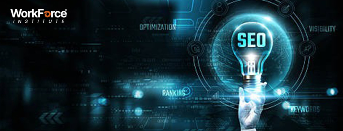 Hand holding a glowing light bulb labeled 'SEO' with digital marketing terms like optimization, visibility, rankings, and keywords in the background – WorkForce Institute branding.