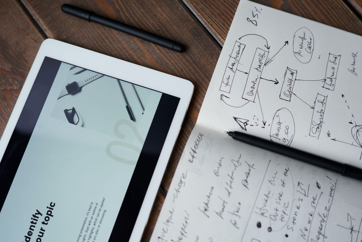 Notebook and tablet showing content marketing strategy